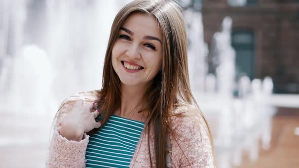 Lifestyle Portrait of Smiling Woman in Stylish Look