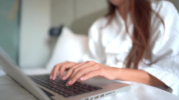 Young asian woman use laptop