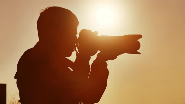 Photographer Taking Photo on Sunset