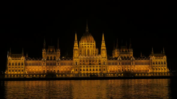 Parliament  building in Budapest night scene with reflection on Danube river 4K 2160p 30fps UHD foot