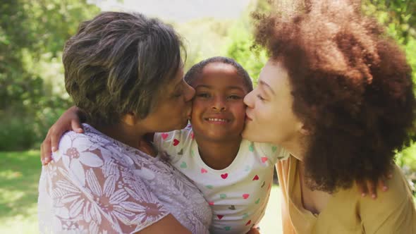 Mixed race woman spending time with her mother and her daughter