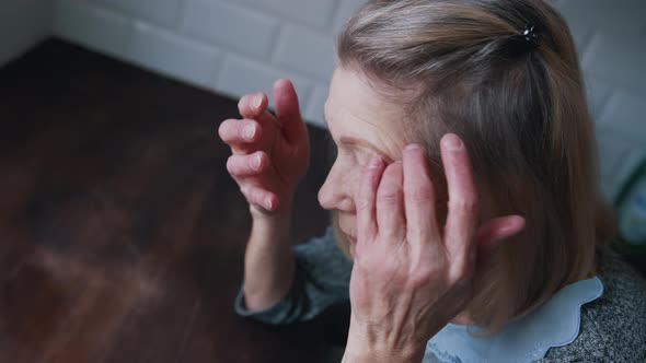 Desperate Lonely Elderly Woman Having a Headache