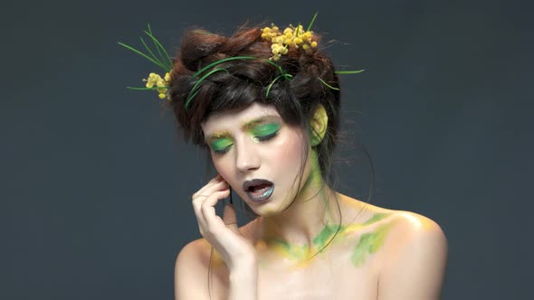 Woman Wearing Nature Themed Makeup.