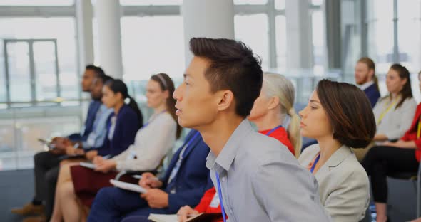 Businessman raising hand in the business seminar 4k