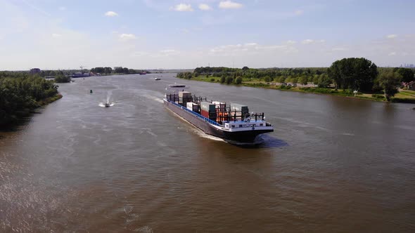 Missouri Container Ship Sailing On Oude Maas River Near Zwijndrecht, Netherlands. Aerial Wide Shot