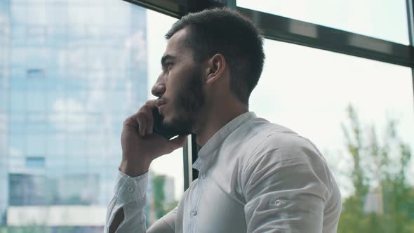 Young Businessman Talking on Phone