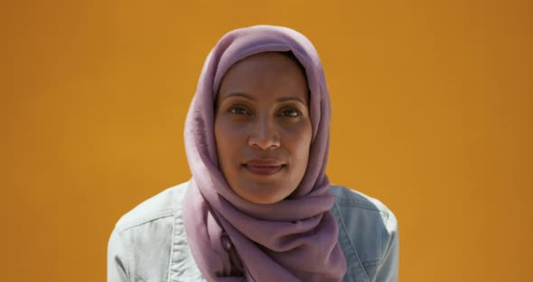 Young woman wearing hijab out and about in the city