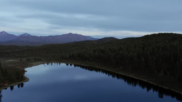 Dramatic sky and lakes in valley of Altai in evening time