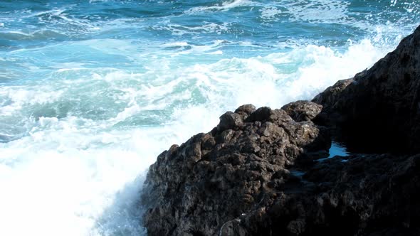 Sea Waves Crash Against Rocks