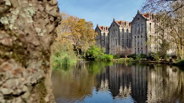 Old Building With Reflection On Lake Water - Parque D Carlos I In Portugal - slow motion revealing s