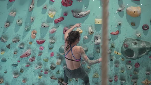 Woman Falling From the Rock Wall Then Camera Shows Climbing Rope Close Up