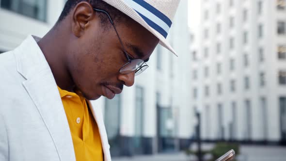 Concentrated African American man in glasses