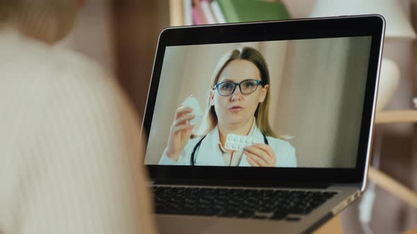 A Woman Consults with a Family Doctor Via Video Call