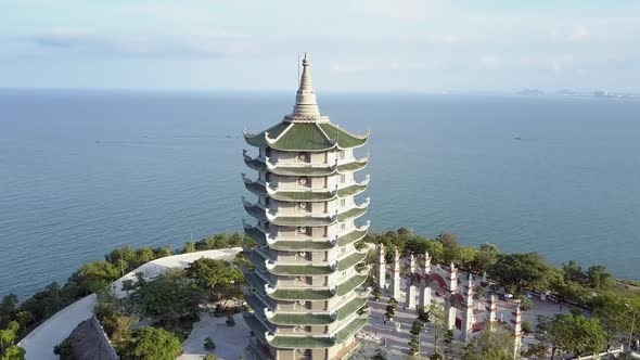 Aerial View Buddhist Temple Pagoda with Gate on Coastal Edge