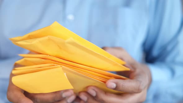 Men Holding Delivery Package Close Up