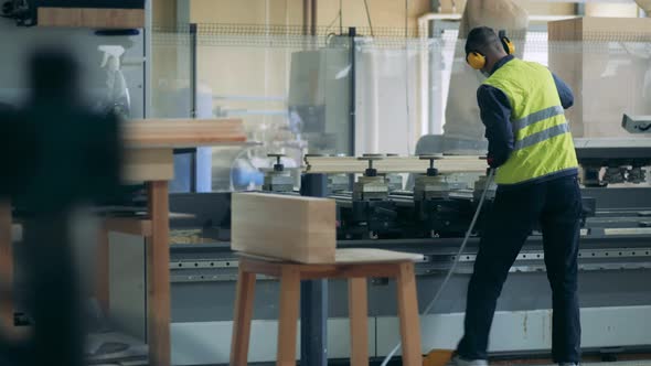 Plant Worker Is Spraying Chemicals on the Industrial Machine