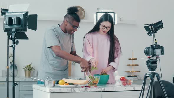 Two Bloggers are Shooting a Cooking Vlog