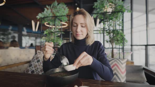 Attractive Blonde in a Restaurant