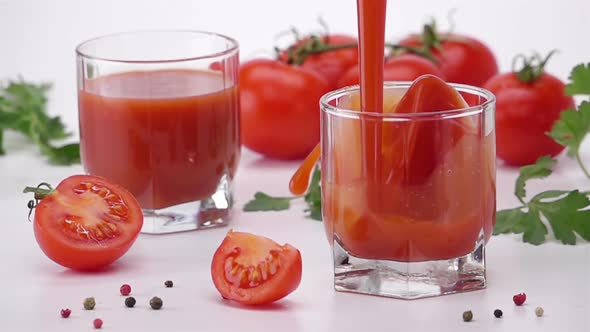 Pouring Tomato Juice Into Glass