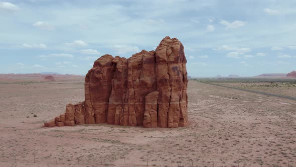 Eroded Rock Formation Standing Amidst Desert By The Road In Apache County, Arizona, United States. A