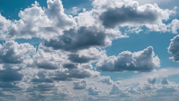Summer Clouds Float Across the Blue Sky in Shuttles Shape Timelapse