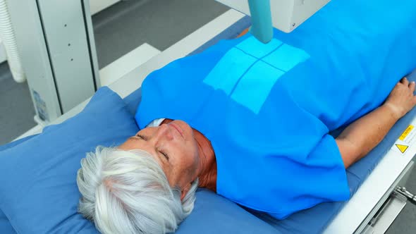 Senior woman undergoing an x-ray test