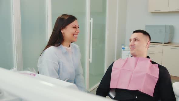 Female Dentist Communicates with Patient