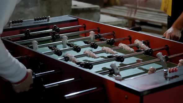 Men Were Playing Table Football at Night Time