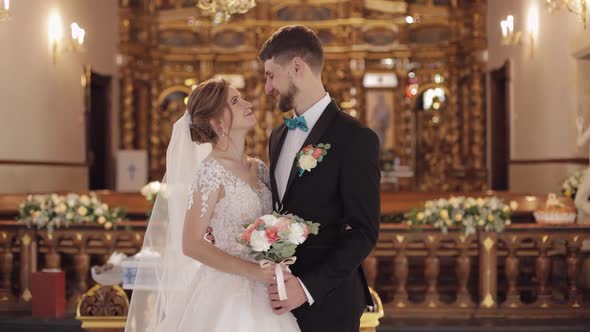 Newlyweds. Caucasian Bride and Groom Together in an Old Church. Wedding