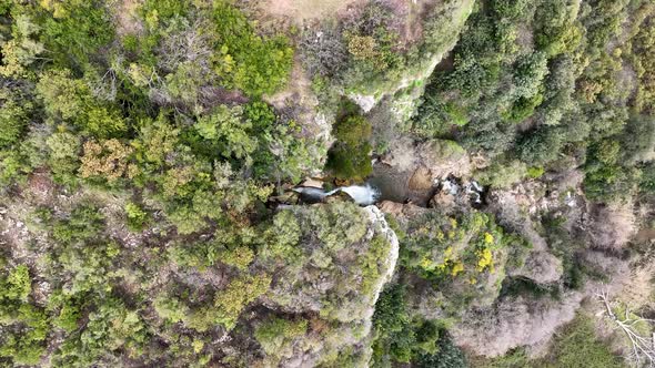 Waterfall in the mountains aerial view 4 K