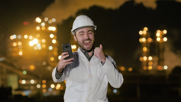 Engineer Taking a Selfie Smiling at Oil Refinery.