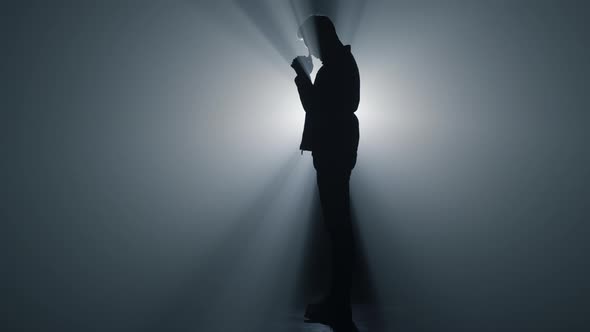 Silhouette Believer Praying in Dark Space alt