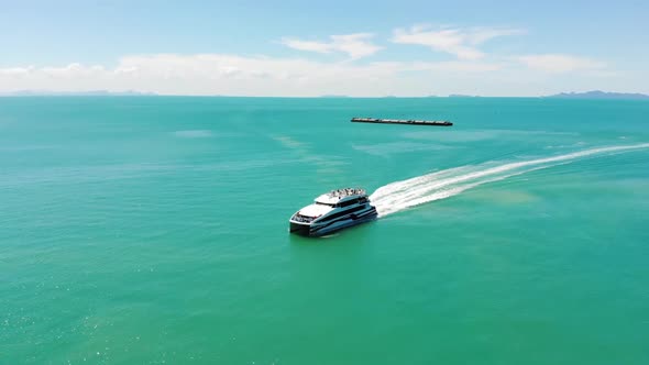 Catamaran arriving from tropical ocean