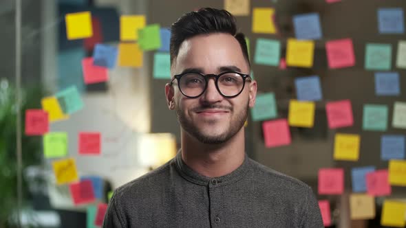 Close Up Portrait Of Young Attractive Happy Handsome Businessman In Glassess Looking At Camera