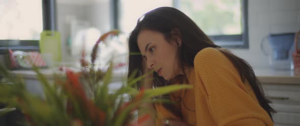 A young woman talking to her boyfriend while feeling hurt and upset