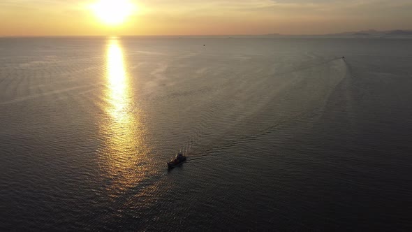 Aerial view silhouette fishing boat sail at sea