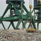 A Magnetic Crane Unloads the Cast Iron Onto the Pier - VideoHive Item for Sale