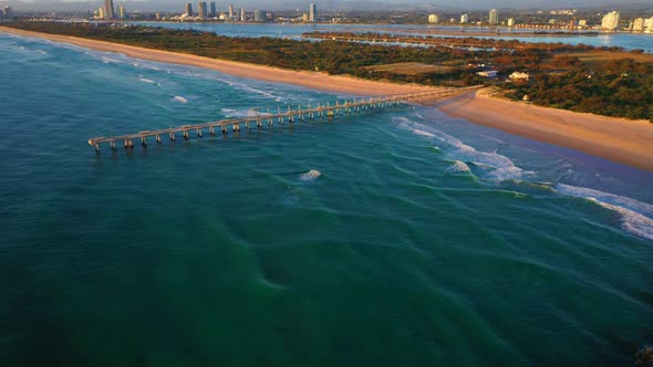 Drone flying over gold Coast seaway and Jetty, sunrise,surf, peaceful