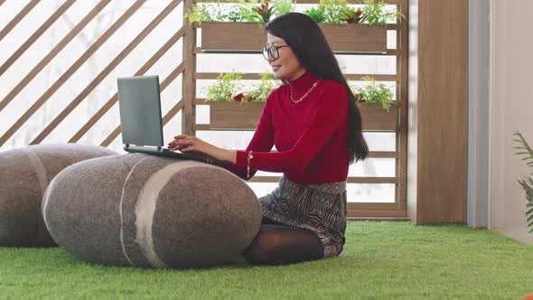 Asian Woman Working in Coworking Space