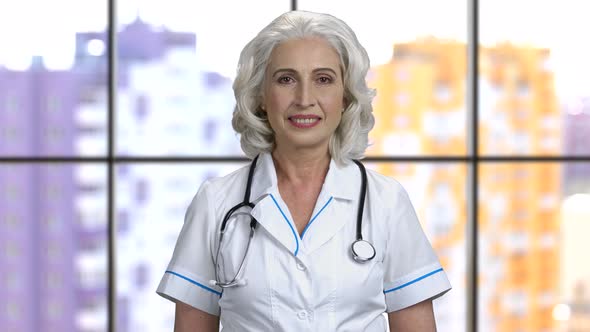 Portrait of a Female Doctor with Grey Hair Wearing Stethoscope