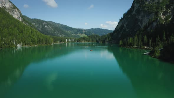 Aerial Footage Over Lake Braies Pragser Wildsee and Mountains in the Background on a Sunny Bright