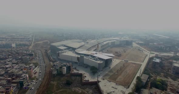 Bombay, India, Aerial flight over the industry, roads and city top view, traffic is going on, Fog in