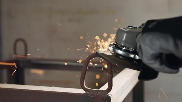 Slow motion of a metal grinder during work with sparks flying