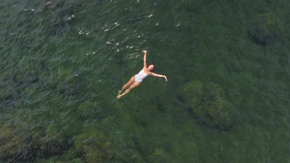 Woman Floating Sea