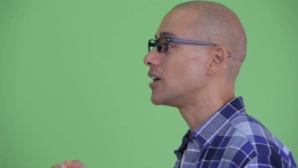 Closeup Profile View of Happy Bald Hipster Man Talking