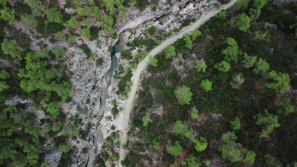 Top View of River on the Bottom of the Gorge and Hiking Path for Tourist Leading Along It