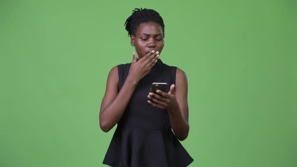 Young Beautiful African Businesswoman Using Phone