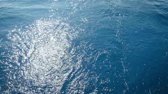 Sunlight Reflection In The Blue Sea - View From A Sailing Boat - high angle shot