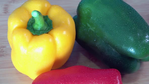 Medium Shot of Fresh Bell Peppers Rotating on a Kitchen Worktop