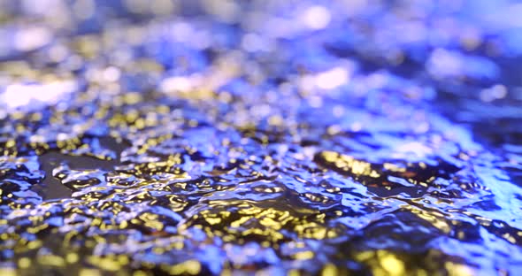 Abstract gold liquid with animated reflections. Golden wave and ripple motion